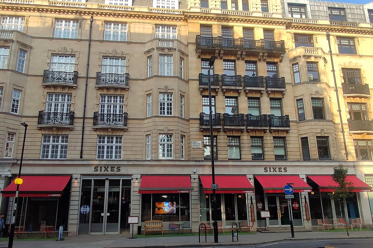The Sixes Cricket Club frontage with red awnings, Marylebone